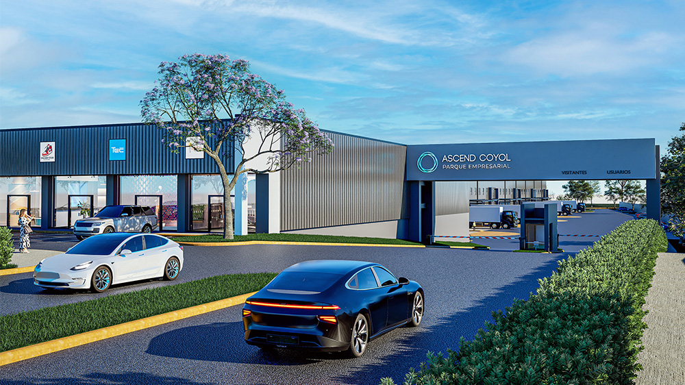 Main entrance of the project with controlled access, dual-lane entry, and glass façade of commercial spaces